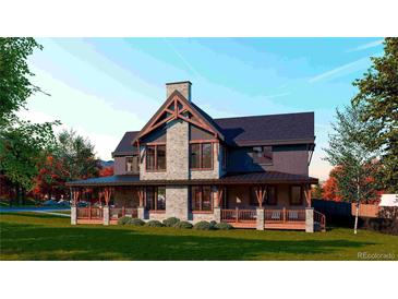 Craftsman home showcasing a stone facade, timber detailing, and a covered porch for seamless indoor-outdoor living at 2315 Illinois St, Golden, CO 80401