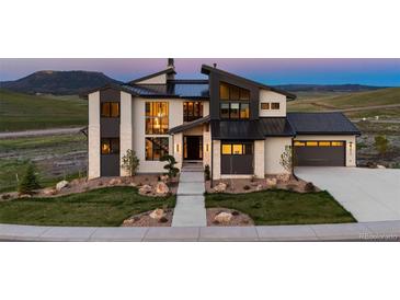 Stunning modern home with clean lines, stone accents, and professional landscaping at 5815 Peppy San Cir, Sedalia, CO 80135