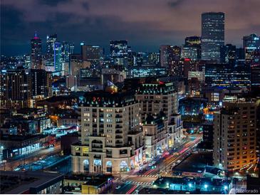 Stunning nighttime view of the city skyline with illuminated buildings and bustling streets at 975 N Lincoln St # 10A, Denver, CO 80203