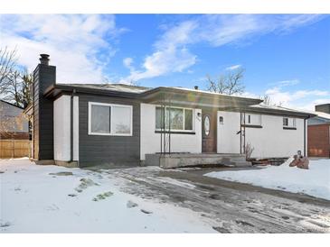 Newly remodeled ranch home exterior with snowy yard at 9300 Grove St, Westminster, CO 80031