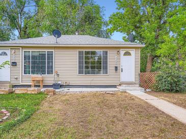 Charming home with a welcoming front porch and well-maintained landscaping at 3304 W 3Rd Ave, Denver, CO 80219