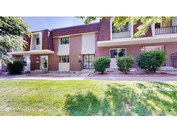 Charming townhome with well-maintained lawn and inviting curb appeal at 663 S Xenon Ct, Lakewood, CO 80228