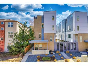 Modern two-story townhome featuring contemporary design and inviting curb appeal at 2044 N High St, Denver, CO 80205