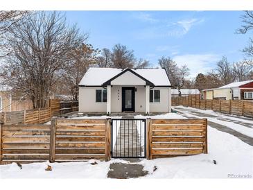 Cute bungalow with modern updates and fenced yard at 5454 Clay St, Denver, CO 80221