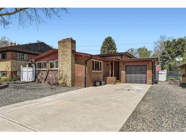 Charming brick home with a spacious driveway and attached garage at 8375 W 17Th W Ave, Lakewood, CO 80214