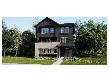 Modern two-story home featuring a stylish two-tone exterior and well-manicured lawn at 8854 Waterleaf Ln, Littleton, CO 80125