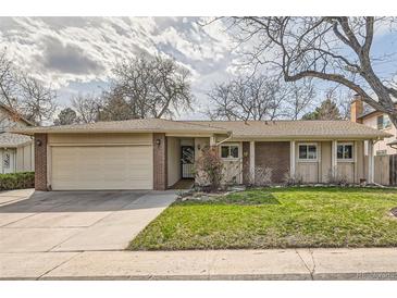 Charming ranch-style home featuring a well-manicured lawn and a two-car attached garage, inviting and functional at 3597 S Joplin St, Aurora, CO 80013