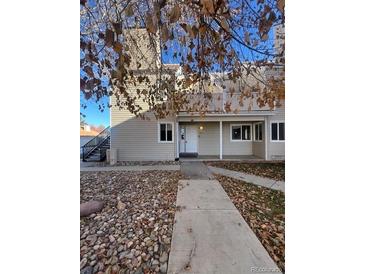Attractive exterior of a condo building with a walkway and landscaping at 2678 S Xanadu Way # C, Aurora, CO 80014