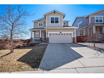Charming two-story home with a well-manicured lawn and a two-car garage at 10554 Casper Pt, Parker, CO 80134