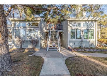 Two-story townhome with stairs and landscaping at 4084 S Carson St # A, Aurora, CO 80014