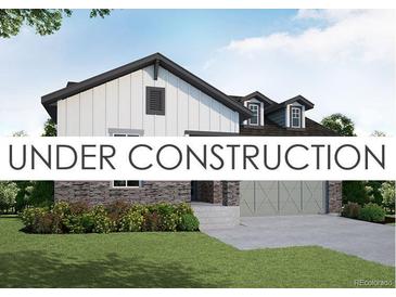 Charming exterior elevation of a home with stone accents and a two-car garage, under construction at 8925 S Riviera Way, Aurora, CO 80016