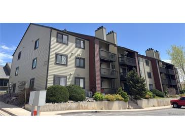 Attractive multi-level apartment building with private balconies and professional landscaping at 10890 W Evans Ave # 3D, Lakewood, CO 80227