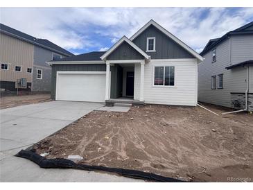 Charming single-Gathering home featuring a two-car garage and stylish gray and white color palette at 4316 Ridgewalk Pt, Arvada, CO 80007