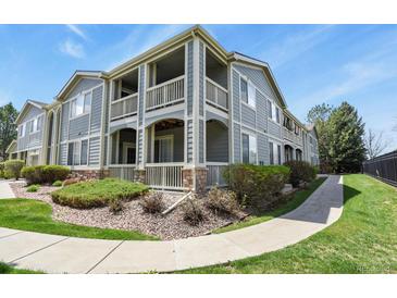 Inviting multi-level condo featuring private balconies and well-maintained landscaping in a residential neighborhood at 1404 Whitehall Dr # C, Longmont, CO 80504