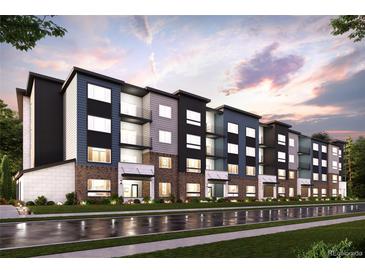 Modern apartment building with brick and siding exterior at 485 Interlocken Blvd # 103, Broomfield, CO 80021