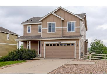 Two-story home with a two-car garage, complemented by a well-manicured lawn at 5546 Echo Hollow St, Castle Rock, CO 80104