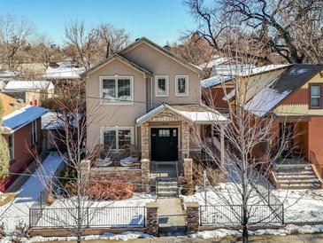 Two-story house with stone accents and a landscaped yard, viewed from above at 1460 S Emerson St, Denver, CO 80210