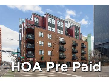 Brick apartment building in downtown with balconies and street-level retail and HOA Pre Paid Text Overlay at 1800 Lawrence St # 408, Denver, CO 80202