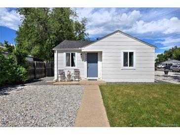 Charming single-story home featuring a well-maintained lawn and inviting front sitting area at 5525 Pierce Ct, Arvada, CO 80002