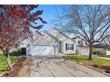 Charming single-Gathering home with a well-manicured lawn and inviting curb appeal and a two-car attached garage at 5611 S Sicily Cir, Aurora, CO 80015