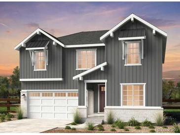 Charming two-story home with gray siding, white trim, and an attached two-car garage at 4334 Ridgewalk Pt, Castle Rock, CO 80108