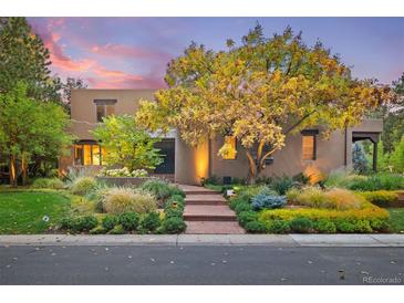 Charming home featuring professionally landscaped grounds and an inviting brick walkway leading to the front door at 9 Polo Field Ln, Denver, CO 80209