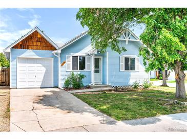 Charming light blue one-story home featuring a one-car garage and well-maintained front yard at 4556 S Pagosa Way, Aurora, CO 80015