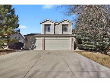 Charming two-story home features a three car garage and a spacious concrete driveway at 5521 S Yakima St, Aurora, CO 80015