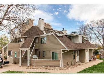 Charming multi-story townhouse with well-maintained landscaping and inviting entrance at 12480 W Nevada Pl # 214, Lakewood, CO 80228