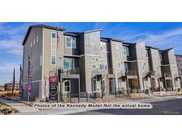Modern townhome exterior; multiple units with balconies and neutral color palette at 2732 W 68Th Ave, Denver, CO 80221