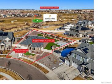 Wonderful aerial view of home, detailing its location on a half acre lot next to Green Valley Ranch Golf Club, and a 3-car tandem garage at 20783 E 50Th Pl, Denver, CO 80249