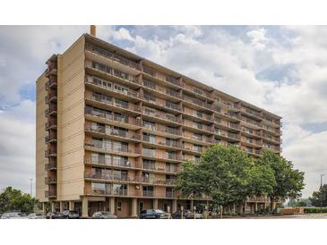 Multi-story building boasts private balconies, neutral facade, and proximity to green space and parking at 2225 Buchtel Blvd # 105, Denver, CO 80210