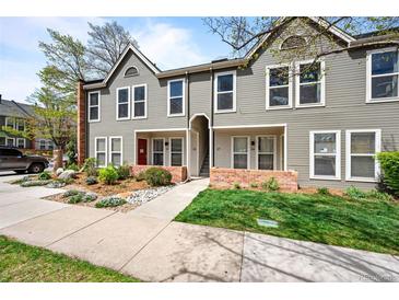 Charming townhome with landscaped front yard and inviting facade under a bright sky at 1150 Inca St # 25, Denver, CO 80204