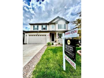 Charming two-story home featuring a spacious two-car garage and well-manicured front lawn, with a 'Coming Soon' sign displayed at 6387 Agave Ave, Castle Rock, CO 80108