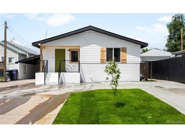 Charming single-Gathering home featuring fresh exterior paint, a green front door, and a small tree in the front yard at 461 S Lowell Blvd, Denver, CO 80219