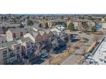 Aerial view of townhomes with a view of the city skyline at 13640 E Iliff Pl, Aurora, CO 80014