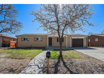Charming single-story home with a well-manicured front yard and an attached one-car garage at 11674 Claude Ct, Northglenn, CO 80233