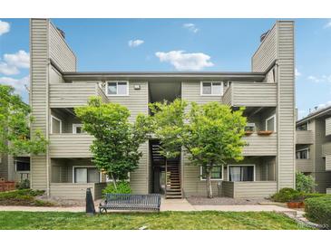Multi-story condo building featuring well-maintained grounds and a welcoming entrance at 3100 S Federal Blvd # 232, Denver, CO 80236