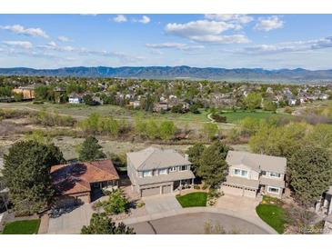Beautiful Denver neighborhood with attractive two-story homes and mountain views in the distance at 9531 Desert Willow Way, Highlands Ranch, CO 80129
