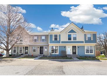 Charming exterior view of townhomes with attractive paint, siding and curb appeal at 1620 S Ivory Cir # C, Aurora, CO 80017