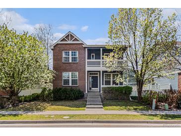 Charming two-story brick home with a lovely front porch and manicured lawn at 3542 W 125Th Dr, Broomfield, CO 80020
