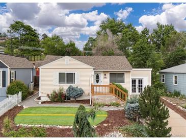 Charming single-story home featuring a well-manicured front yard, complemented by lush landscaping and decorative shrubbery at 116 N Gilbert St, Castle Rock, CO 80104