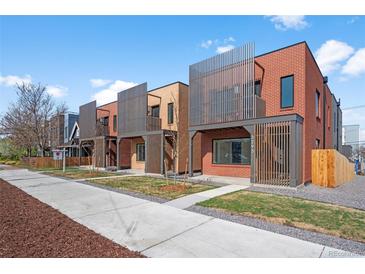 Modern townhomes showcasing clean lines and attractive exterior design with vertical slat accents at 3285 Lawrence St, Denver, CO 80205