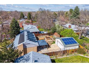 Overhead view of house with solar panels and a backyard with a gazebo and garden boxes at 1744 S Leyden St, Denver, CO 80224