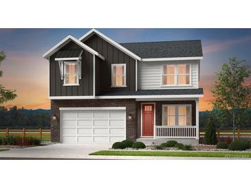 Charming two-story home features a two-car garage, brick accents, and a welcoming front porch at 3333 N Catawba Way, Aurora, CO 80019