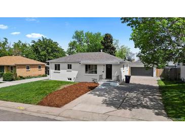 Charming single-story home with fresh landscaping, newly painted exterior and detached garage in the back at 2542 S Winona Ct, Denver, CO 80219