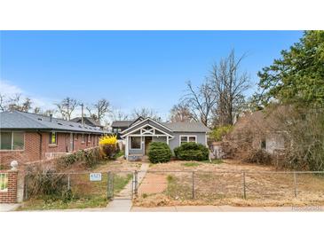 Charming single-story home with a well-maintained lawn and inviting curb appeal at 4325 Perry St, Denver, CO 80212