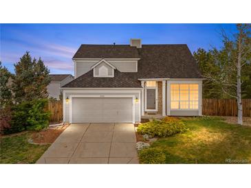 Charming two-story home features a two-car garage, stone accents, and well-maintained landscaping at 8164 S York Ct, Centennial, CO 80122
