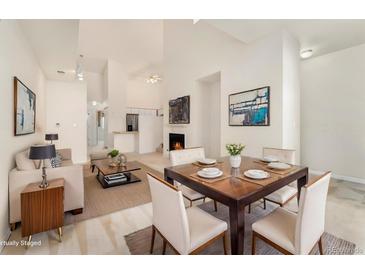 Bright dining area with hardwood floors and modern light fixtures at 18152 E Flora Pl # D, Aurora, CO 80013