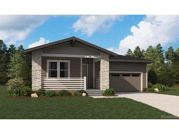 Charming single-story home with stone accents, a covered porch, and an attached two-car garage at 45933 Wood Thrush Ave, Bennett, CO 80102